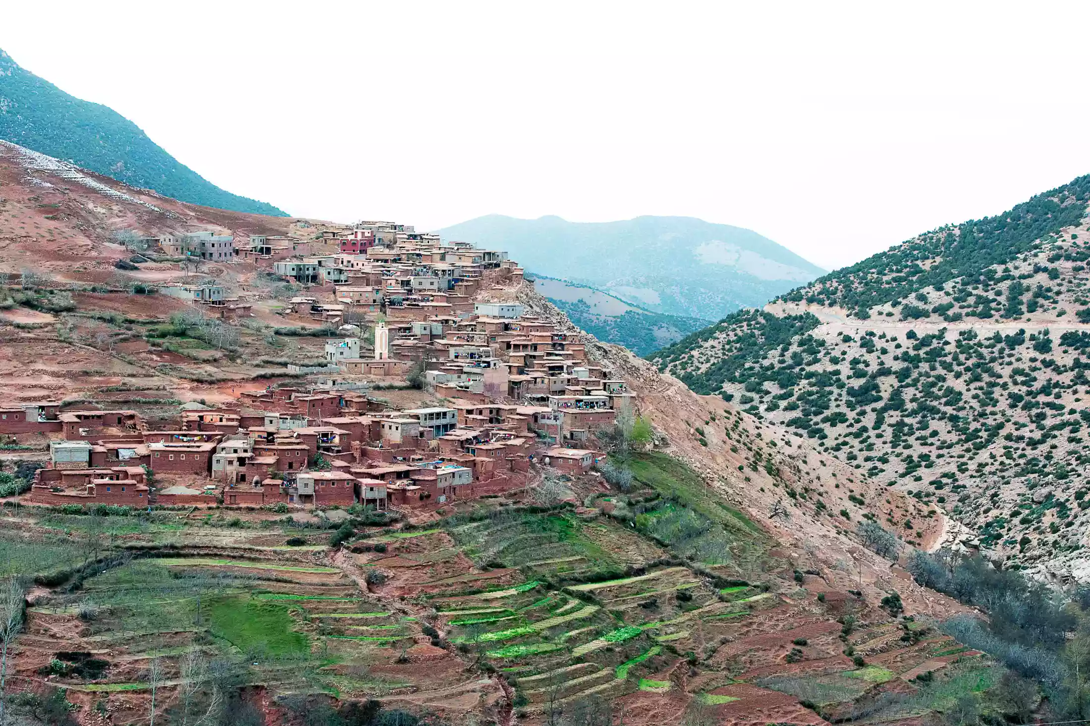 Berber village clings to the hillside of the High Atlas Mountains, Morocco